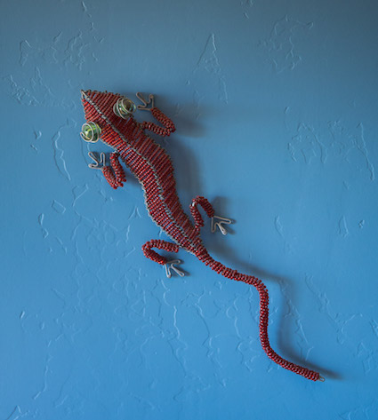 Beaded gecko on wall
